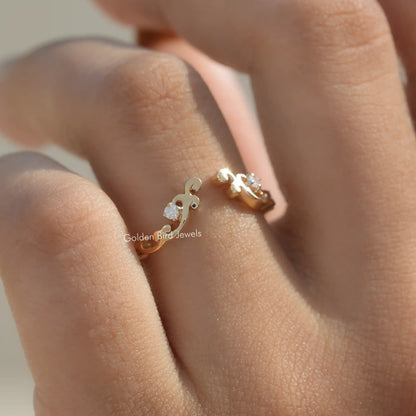 Gold-tone open cuff stacking band ring with small round lab diamonds, top view