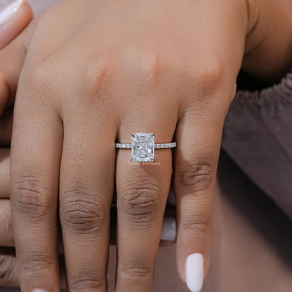 Moissanite solitaire accent ring on fingers, square center stone with slim sparkling sides