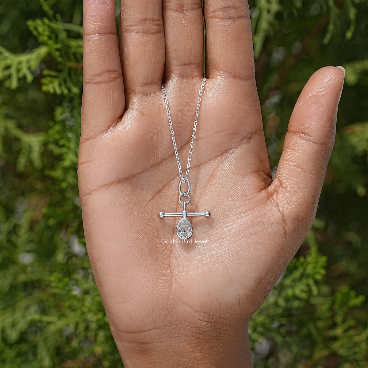 Silver pear-cut bezel pendant necklace, teardrop stone on a fine chain