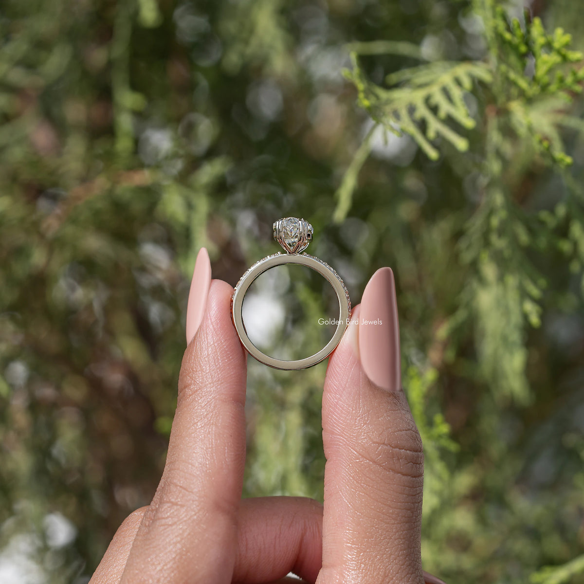 Silver marquise-cut moissanite solitaire ring with split band and small pave stones