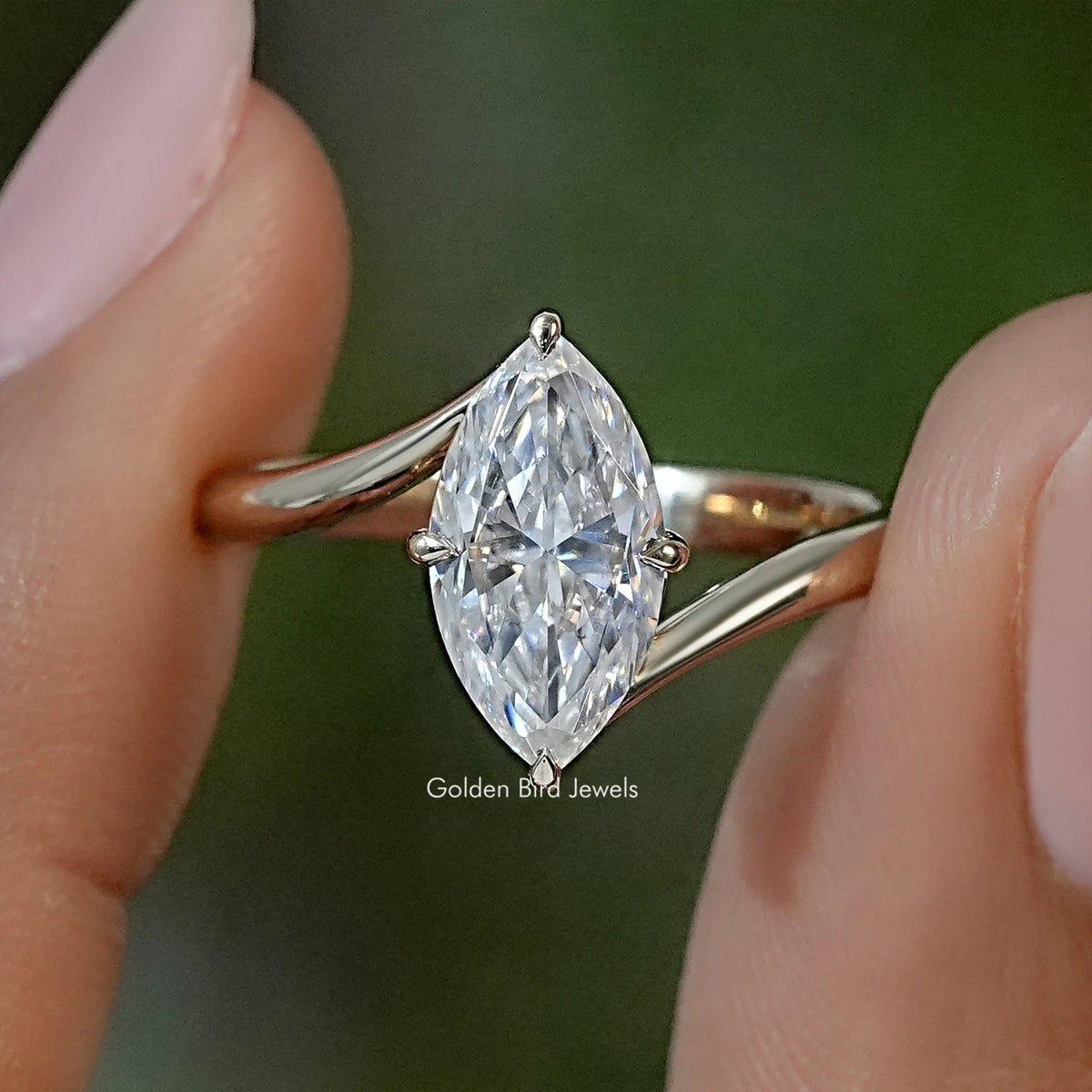 Marquise moissanite solitaire ring with prong-set pear-shaped center stone