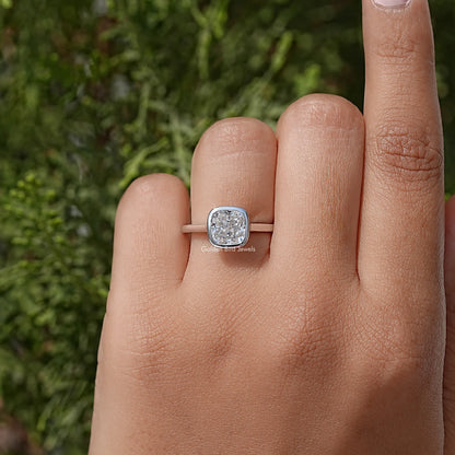 Cushion moissanite bezel promise ring with 925 sterling silver band on finger