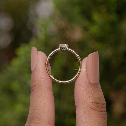 Gold-tone solitaire ring band with prong-set baguette-cut moissanite center stone