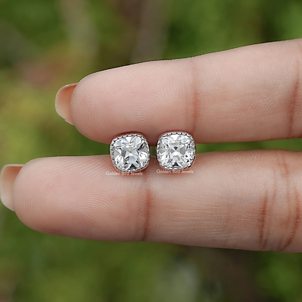In Hand View Of Square Cut Lab Diamond Stud Earrings