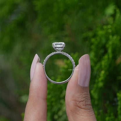 Back View of Radiant Cut Diamond Engagement Ring In two fingers