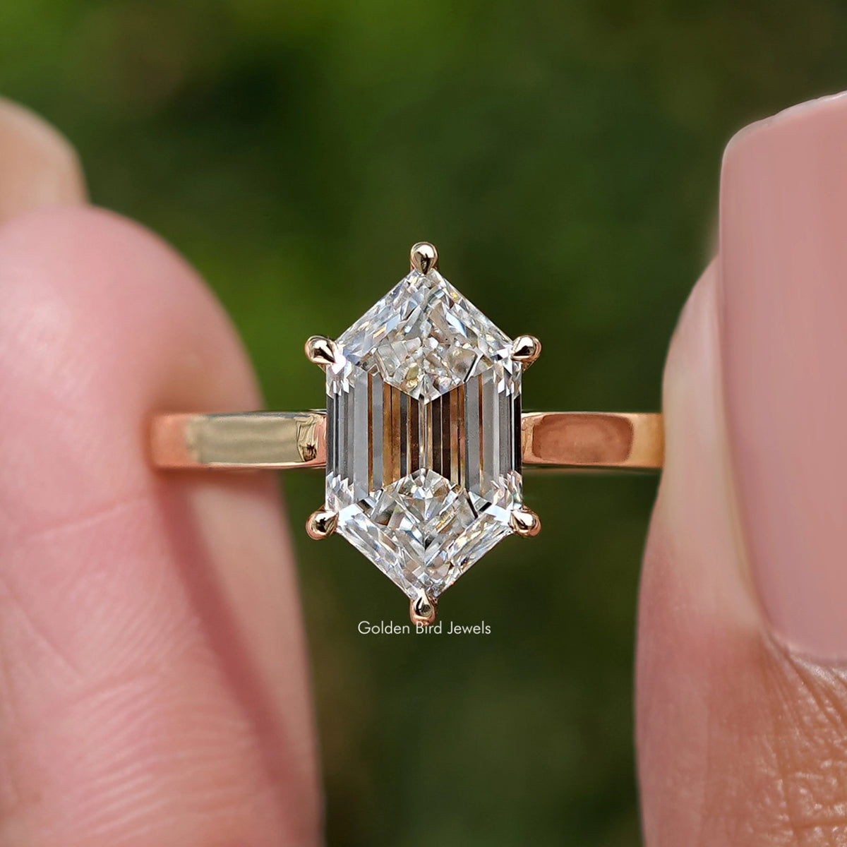 Step-cut marquise diamond ring, close-up of step-cut center stone and prongs