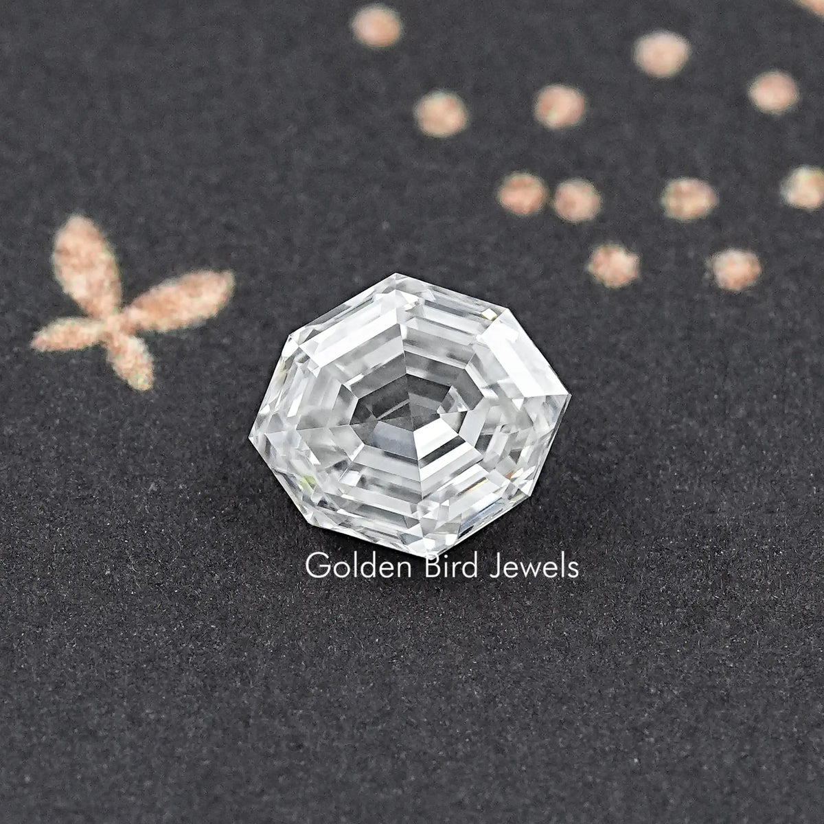 Faceted moissanite loose stone, step-cut clear gem, close-up view