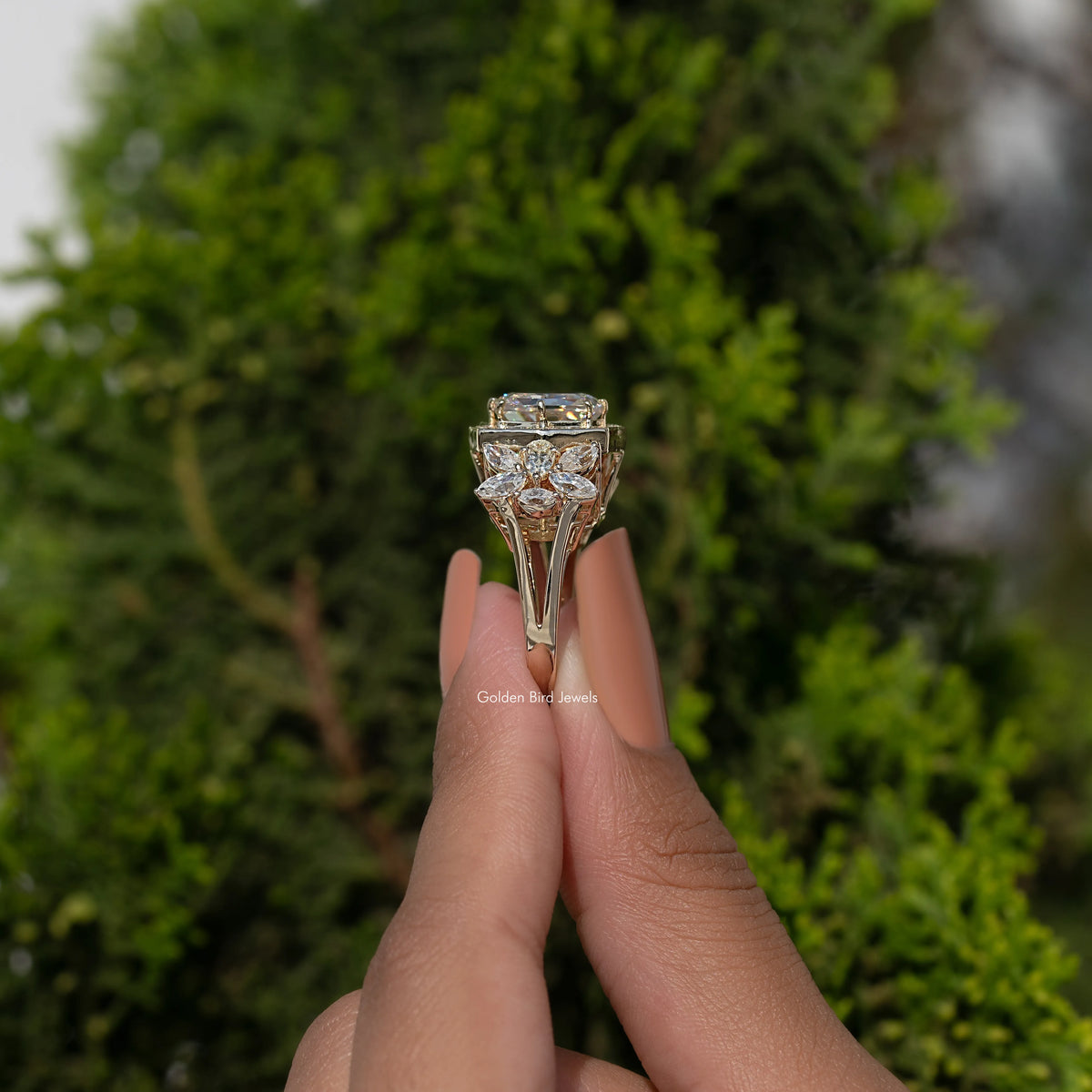 Cushion-cut moissanite ring top view, gold-tone halo and prong setting