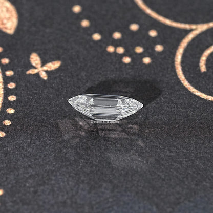 Marquise step-cut lab diamond, clear white with flat step facets and sparkle.