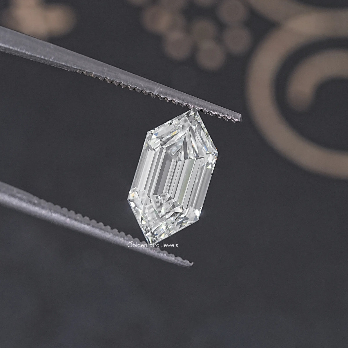 Emerald step-cut lab diamond, clear and transparent with long linear facet lines.