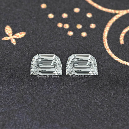 Pair of step-cut lab-grown diamonds, rectangular emerald cuts side by side