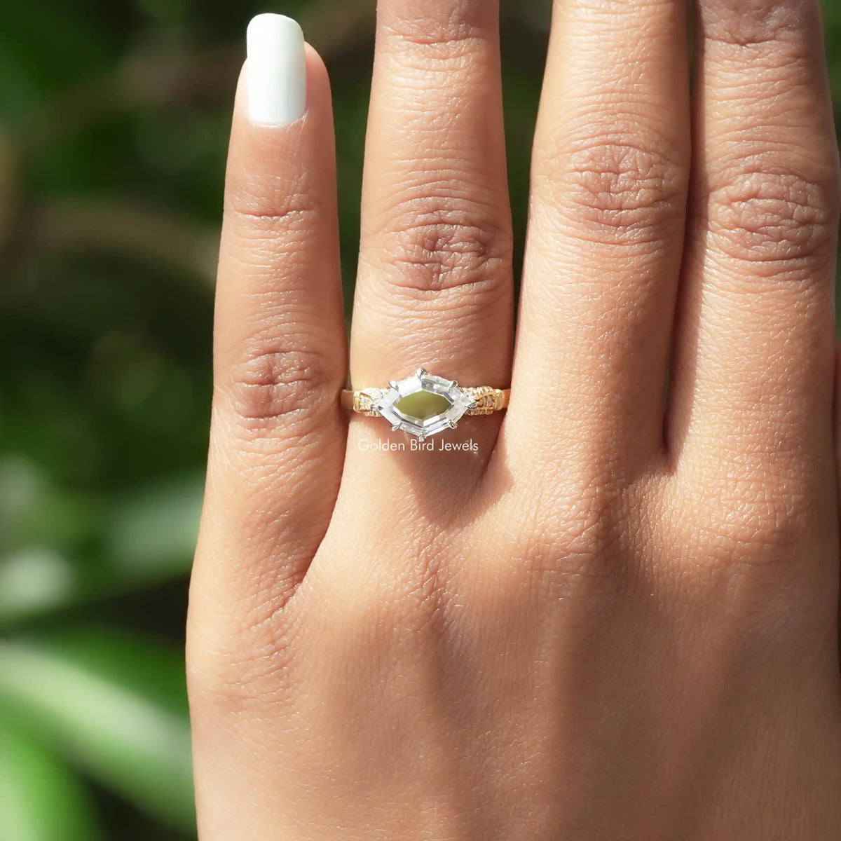 Detailed View Of Step Cut Marquise Hidden Halo Moissanite Ring In Yellow Gold