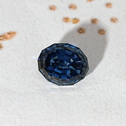 Loose step-cut oval blue moissanite gemstone in close-up view