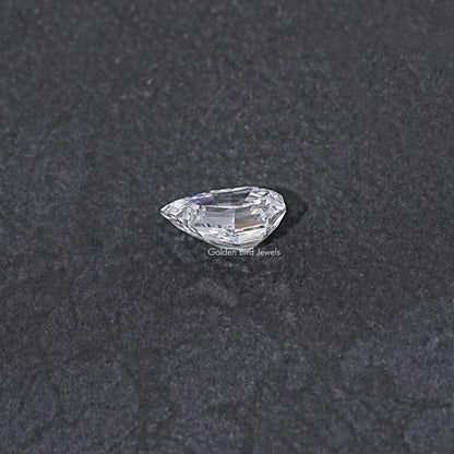 Lab-grown pear-cut diamond, step-cut faceting, loose stone close-up
