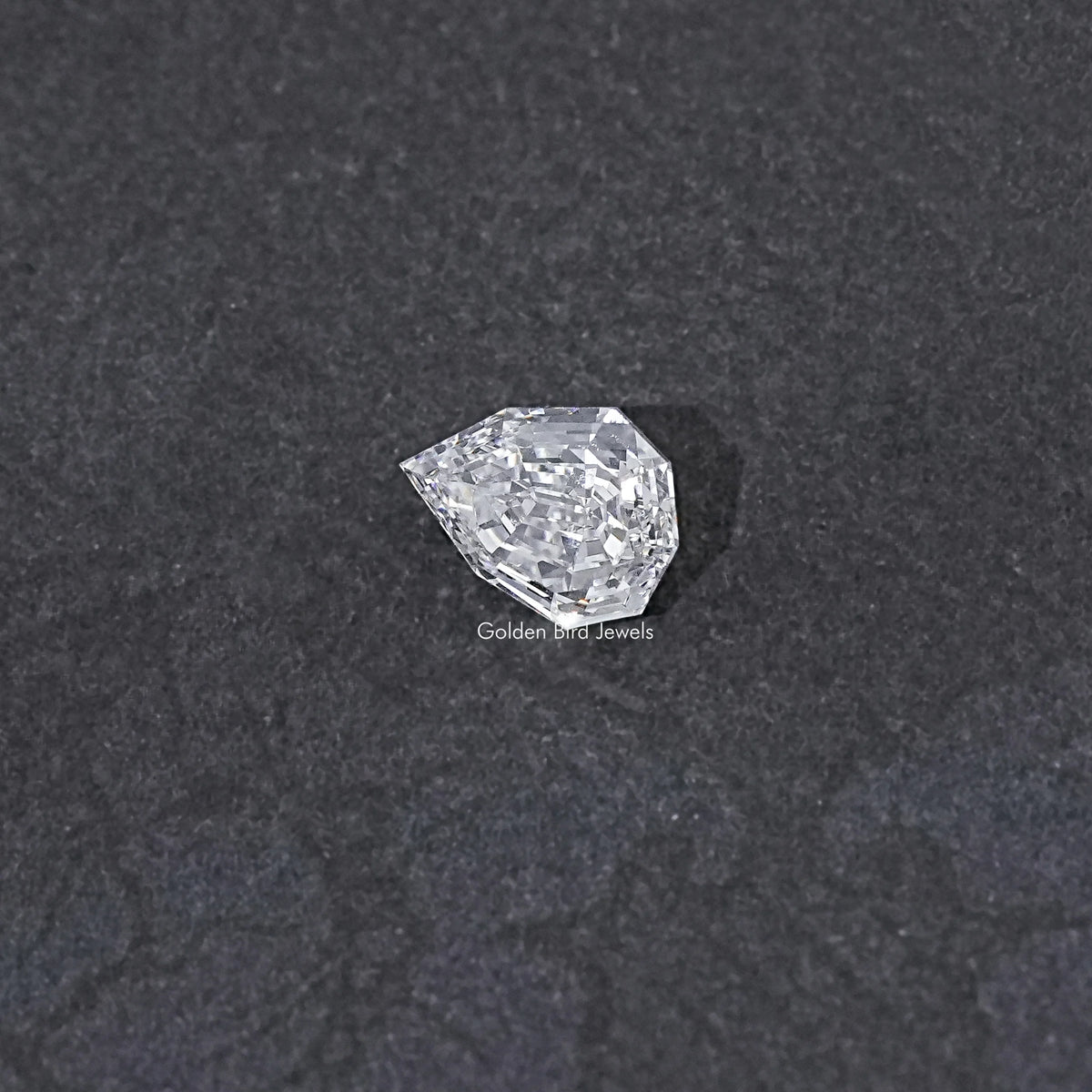 Lab-grown pear-cut diamond with step-cut sparkle, loose stone close-up