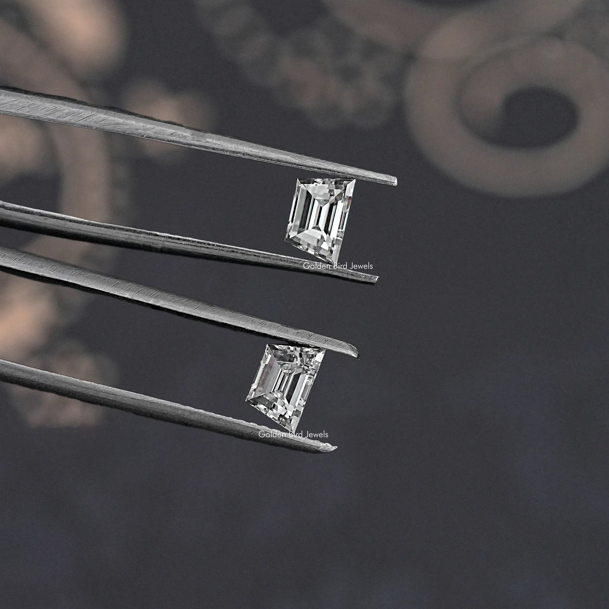Prong-set trapezoid lab diamond stud earrings pair with stepped facets, angled view