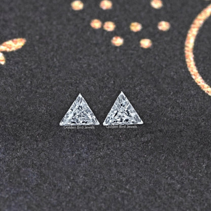 Pair of step-cut triangle lab-grown diamonds, triangular faces close-up