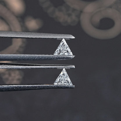 Step-cut triangle lab-grown diamonds in silver settings, close-up from top