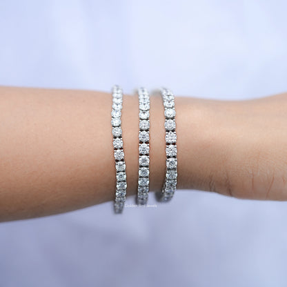 Silver round-cut diamond tennis bracelet, close-up of three parallel bands