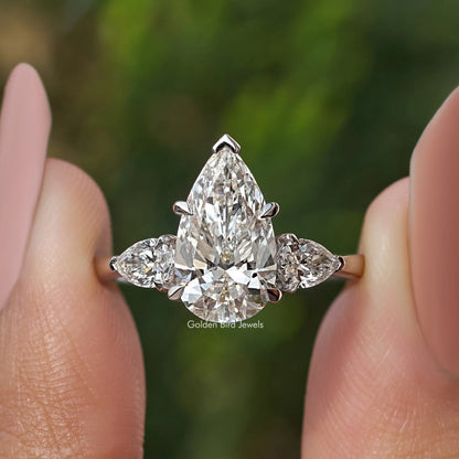 Three-stone pear-cut diamond engagement ring, large center pear with two side diamonds