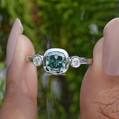 Three-stone cushion-cut moissanite ring with round side stones, silver band