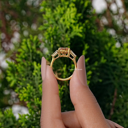 Gold ring with cushion-cut center stone and baguette side stones, top view