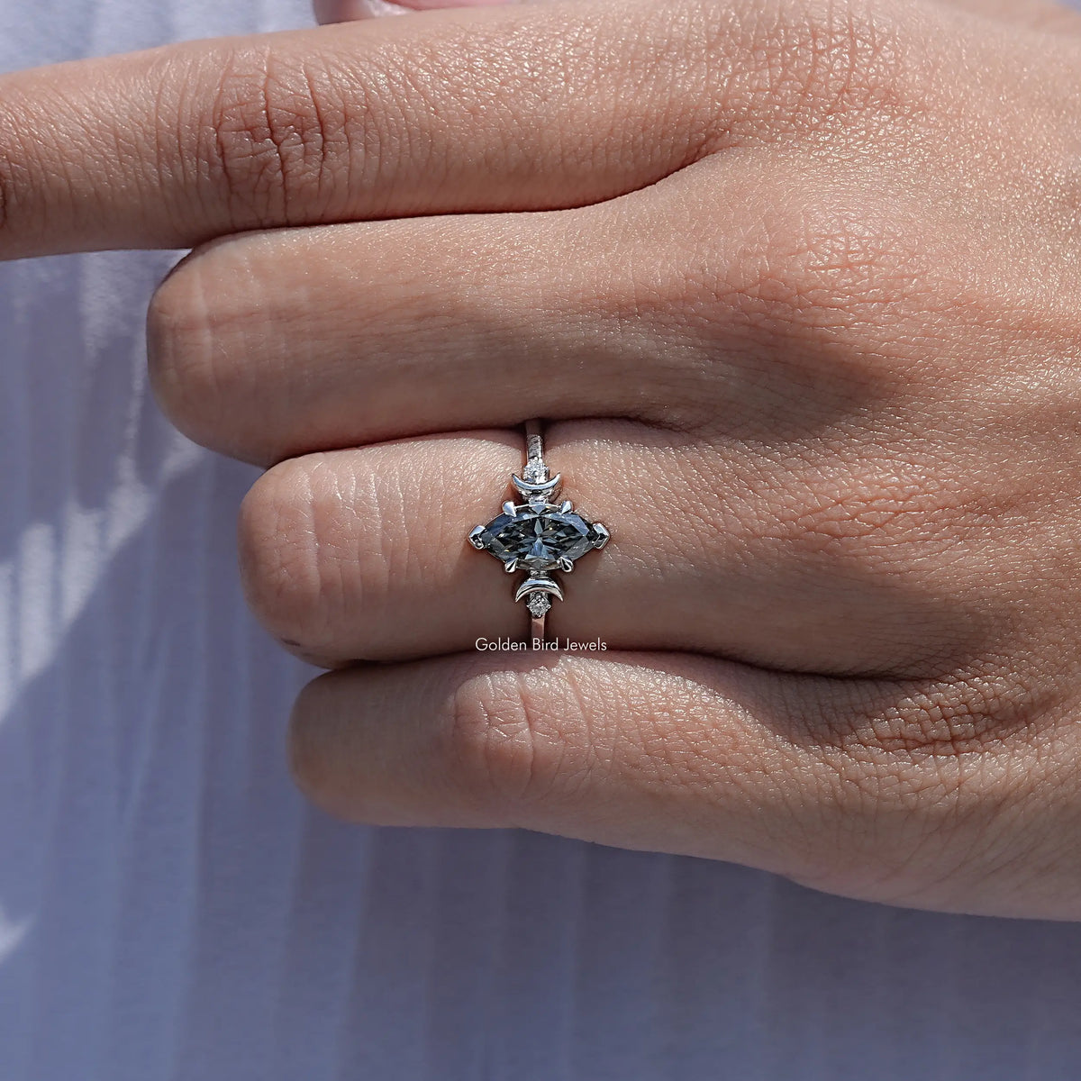 Close View Of Three Stone Marquise Moissanite Ring
