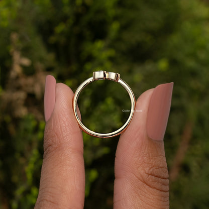 Gold-tone ring from behind with slim band and rectangular prong-set diamond center