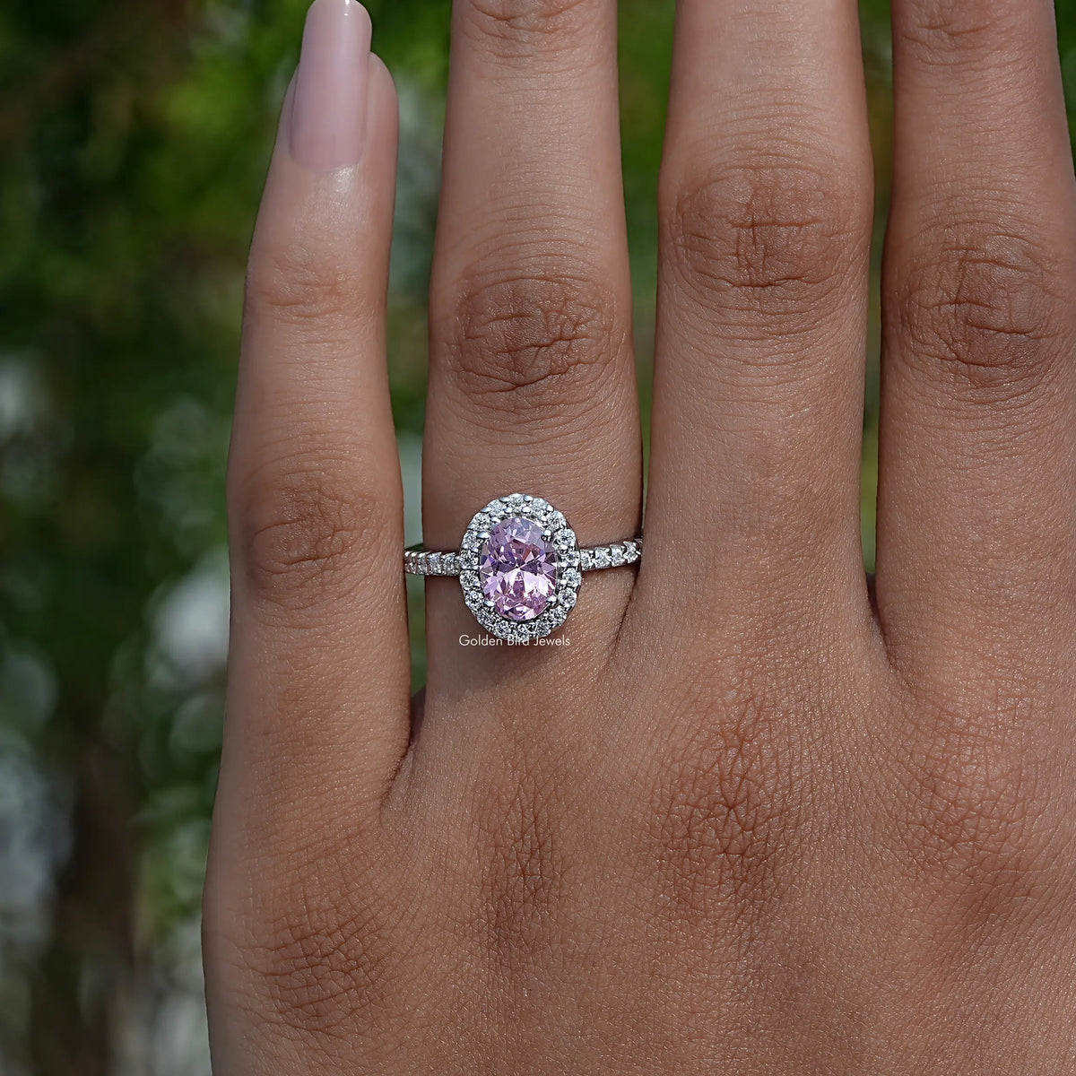 Detailed View Of Oval Cut Gemstone Halo Accent Ring