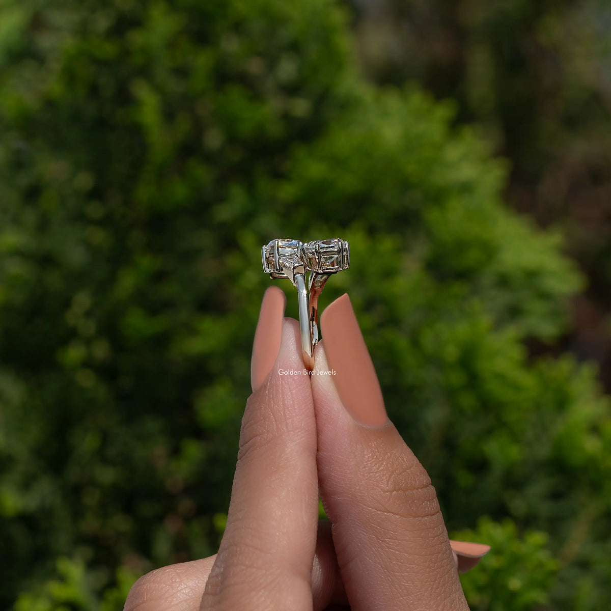 White metal cushion-cut diamond engagement ring with baguette side details