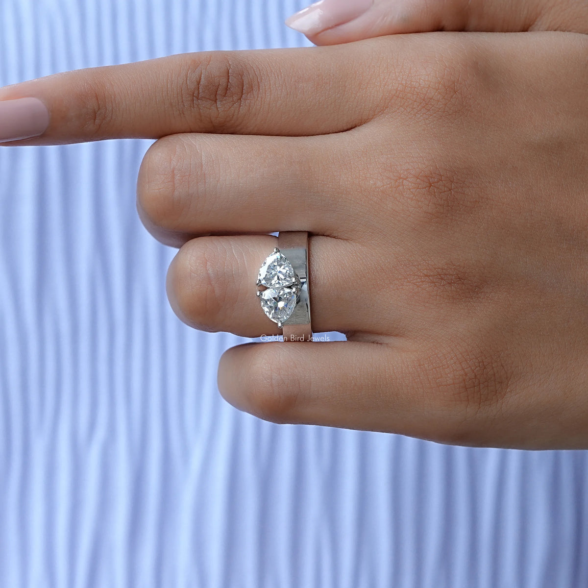 Two-stone moissanite engagement ring with square prongs and split-shank band