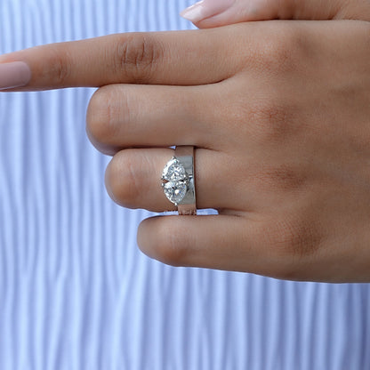 Two-stone moissanite engagement ring with square prongs and split-shank band