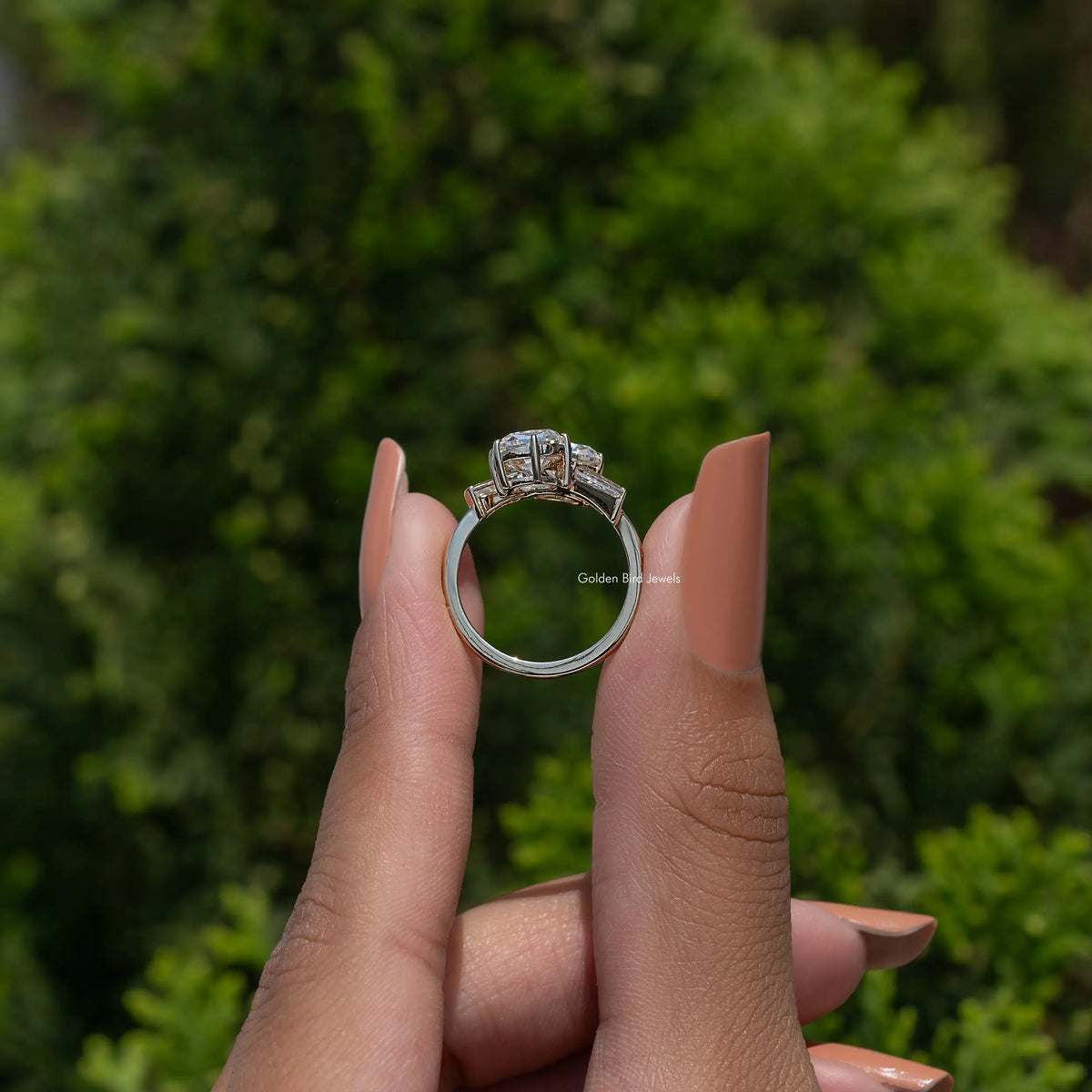White metal bypass engagement ring showing open band and cushion center stone