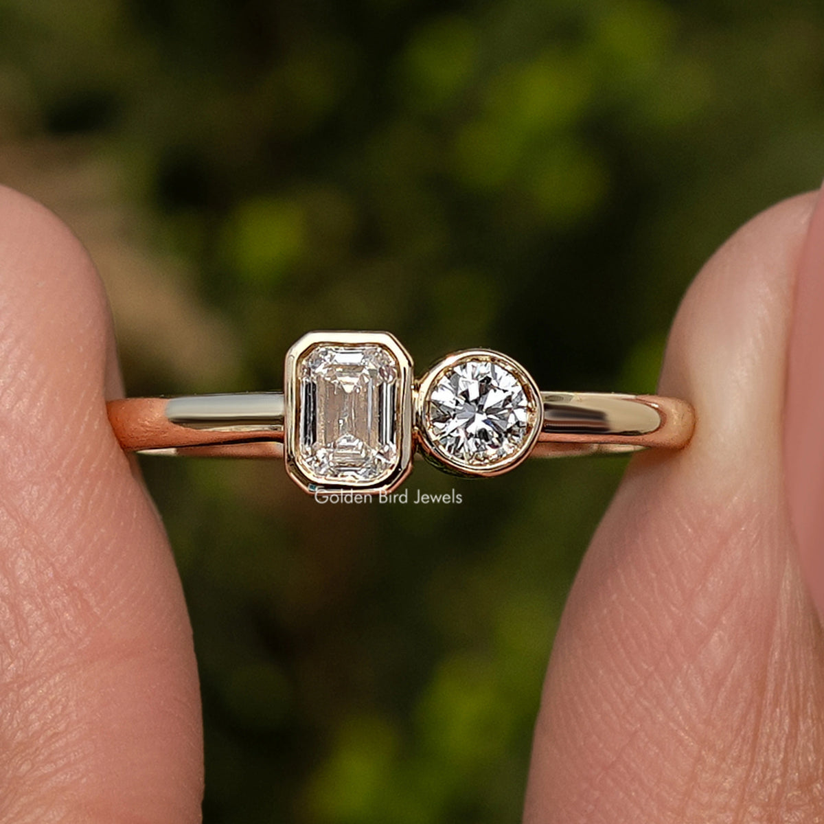 Gold-tone toi et moi ring with emerald-cut lab diamond and round lab diamond side by side