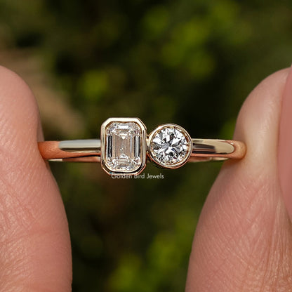 Gold-tone toi et moi ring with emerald-cut lab diamond and round lab diamond side by side