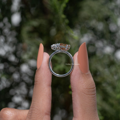 Toi et moi ring showing the inside band, prong-set moissanite with warm brown center