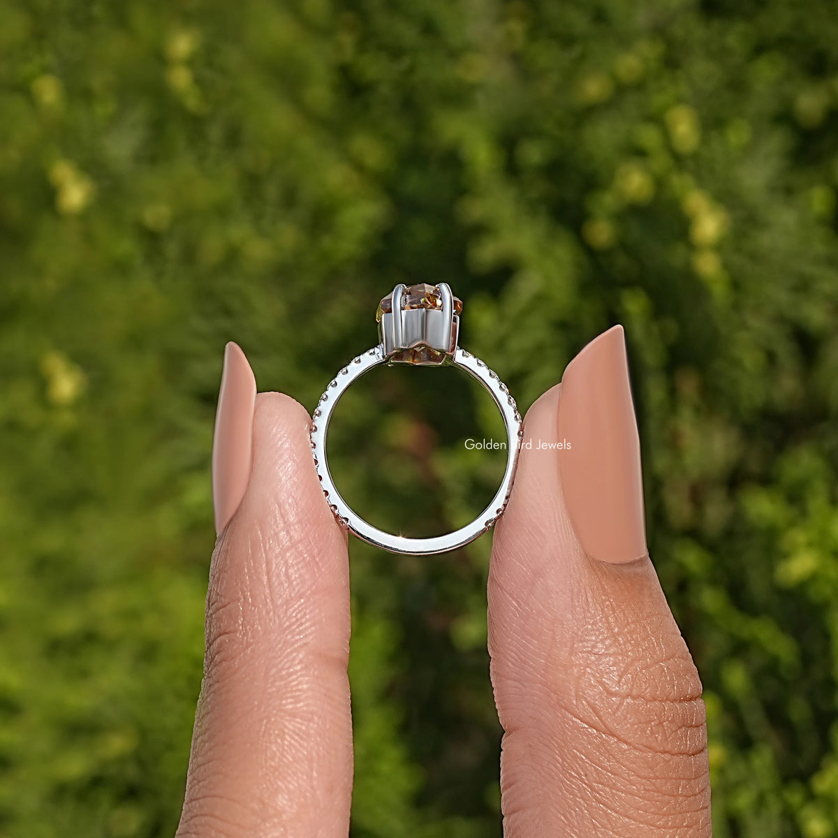 Silver-toned ring top view with marquise center stone in prong setting