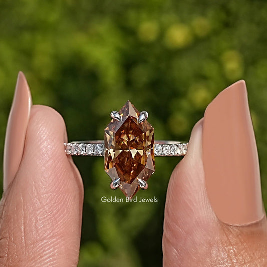 Marquise-cut moissanite solitaire ring with pavé band and prong setting