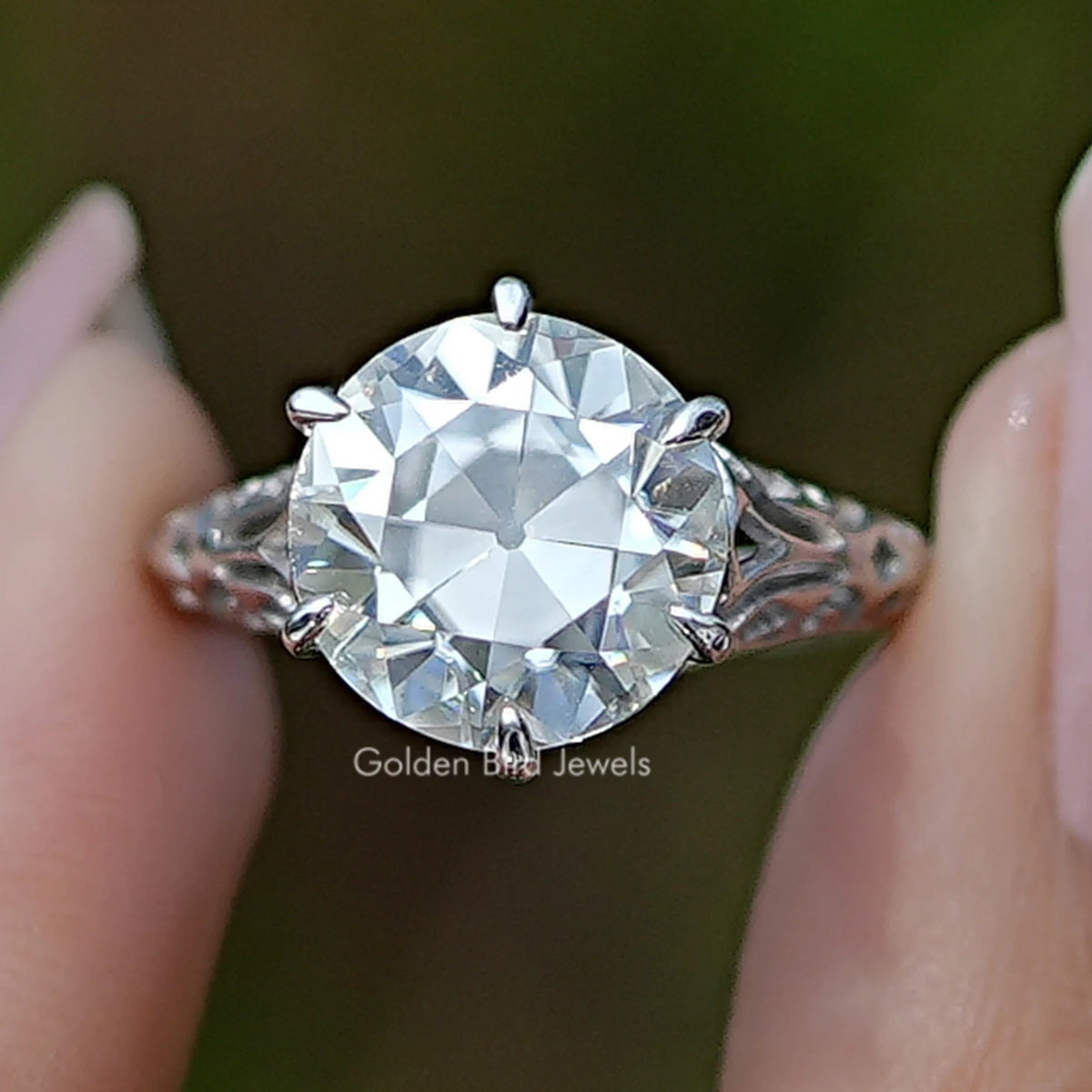 Round moissanite vintage engagement ring with prong-set center stone, sterling silver