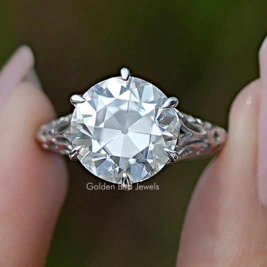 Round moissanite vintage engagement ring with prong-set center stone, sterling silver
