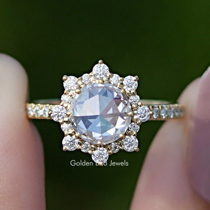 Gold-tone halo moissanite ring with round center stone and small side stones
