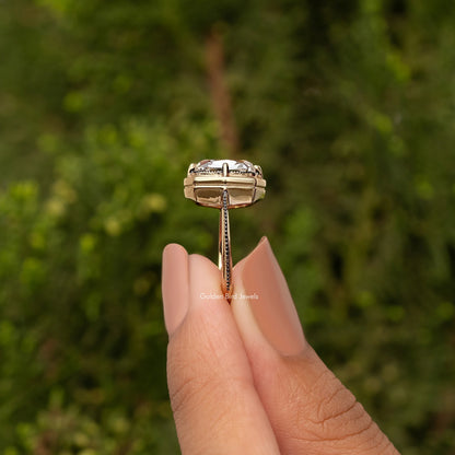 Gold-tone cushion-cut bezel set engagement ring, side profile with raised setting