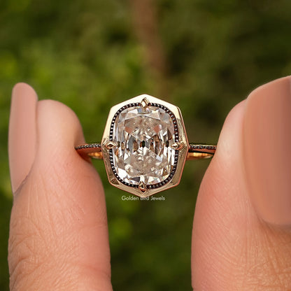 Gold-tone cushion-cut bezel set engagement ring with detailed halo, front view