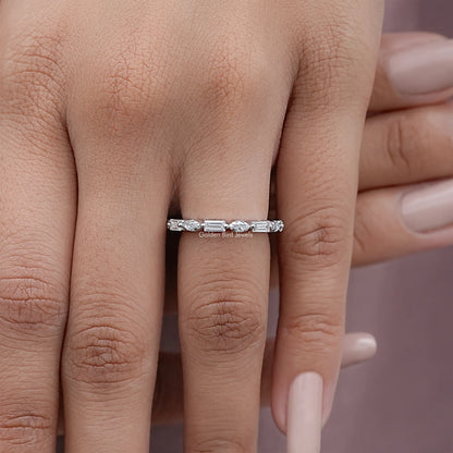 Silver full eternity ring with marquise and baguette-cut stones, worn on finger
