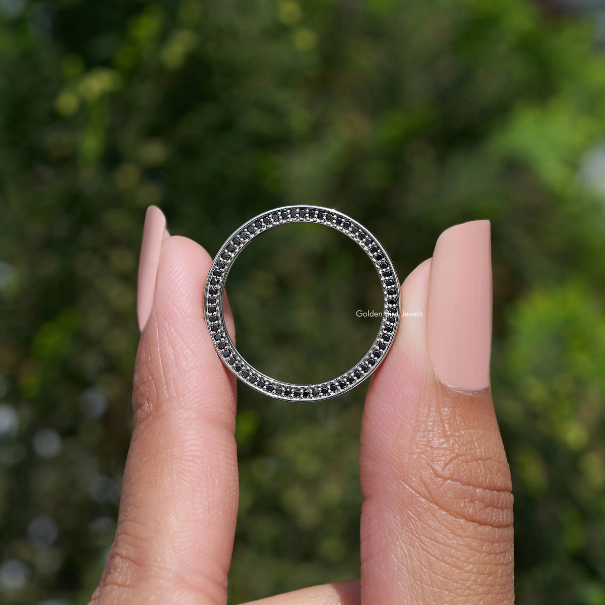 Silver-tone channel-set ring band with round stones, ring face shown