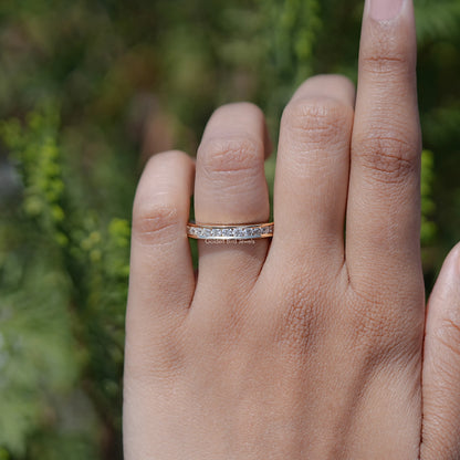 Silver half-eternity band on finger, slim profile with channel-set stones