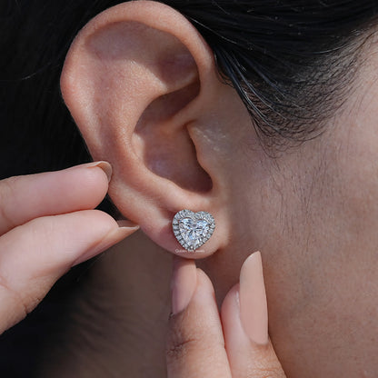 Close-Up View of Heart Shaped Diamond Halo Stud Earrings In White Gold