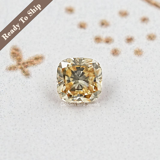 Yellow cushion-cut moissanite gemstone, centered square cushion facet view