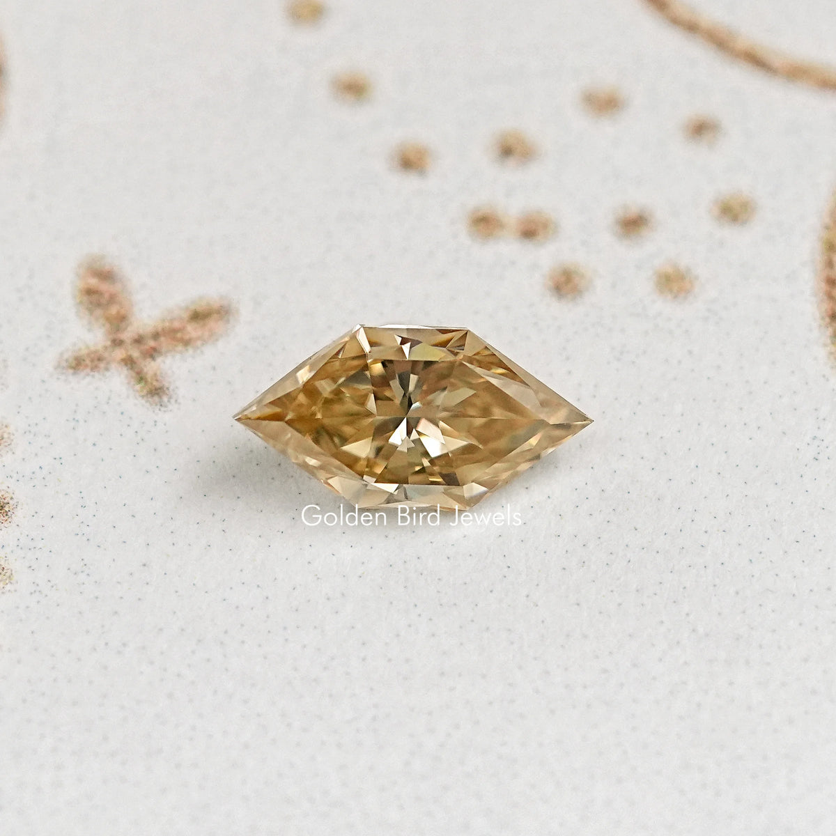Faceted marquise golden moissanite gemstone, bright center facet and beveled edges