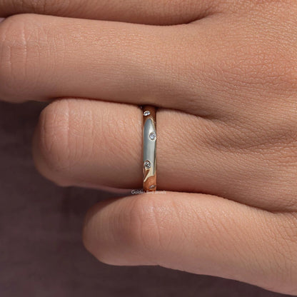 Flush-set diamond eternity band ring, close-up of band with round diamond settings